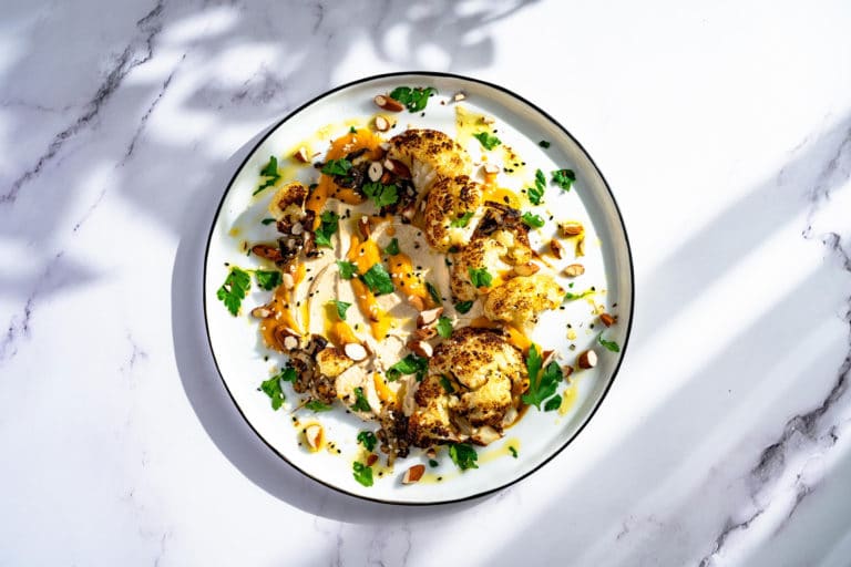 Roasted cauliflower with hummus and amba mango sauce