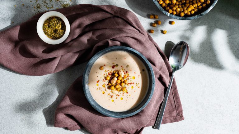 Cream of white bean soup served on a table